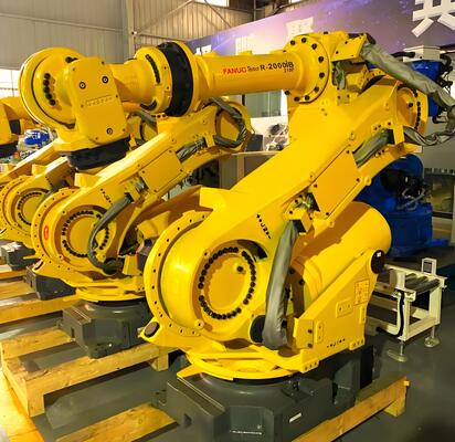 自動車産業における 3D 金属ワークの量産向け、自動ロード/アンロードおよびターンテーブルを備えたファナック レーザー切断セル